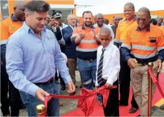  ?? ?? Tsogwane cutting the ribbon to mark the official opening of the training centre