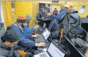  ?? WASEEM ANDRABI/HT ?? Mediaperso­ns using internet at the special centre set up by the government in Srinagar on Wednesday.