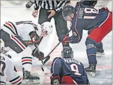  ?? [ADAM CAIRNS/DISPATCH] ?? The Blue Jackets’ Pierre-Luc Dubois takes a faceoff against the Blackhawks’ David Kampf during an exhibition game on Sept. 19. The Jackets have struggled on faceoffs in the regular season, winning just 43.3 percent.