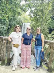  ?? ?? The tallest of the seven waterfalls: With the author are (from left) Niña Estela and Marisa Velasco