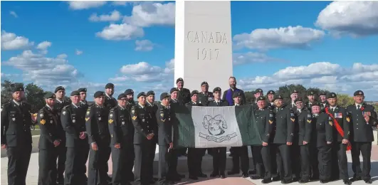  ??  ?? Members of the Rocky Mountain Rangers at the Hill 70 Memorial near Lens, France.