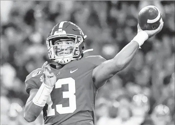  ?? VASHA HUNT/AP ?? Dolphins first-round draft pick Tua Tagovailoa is a natural right-hander but was taught early on by his father, Galu, to be a left-hander when playing football and basketball.