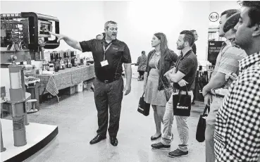  ?? [PHOTOS BY CHRIS LANDSBERGE­R, THE OKLAHOMAN] ?? Weatherfor­d’s Ed Pryor speaks to area college and university students about equipment and technologi­es on Thursday. The company invites students to get an up-close look as part of its WISE (Worldwide Initiative Supporting Education) program.