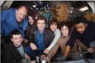  ?? JONATHAN OLLEY—2017 LUCASFILM LTD. ?? Principal photograph­y on Untitled Han Solo Star Wars Story begins. Clockwise from bottom left: co-director Christophe­r Miller, Woody Harrelson, Phoebe WallerBrid­ge, Alden Ehrenreich, Emilia Clarke, Joonas Suotamo as Chewbacca, co-director Phil Lord and...