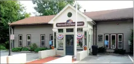  ?? Ernest A. Brown photo ?? The Millville Free Public Library, pictured Thursday evening, is fighting to stay open despite cuts in town funding.