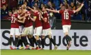  ?? Kammermaye­r/REX/Shuttersto­ck ?? Sparta Prague’s David Hancko is mobbed by his teammates after heading them in front against Rangers. Photograph: Milan