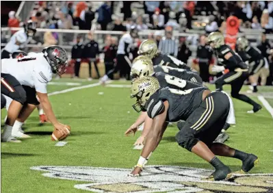  ?? Tim Godbee ?? The Calhoun defensive line stands ready against the Morgan County Bulldogs at Hal Lamb Field at Phil Reeve Stadium on Friday, Nov. 15. The Yellow Jackets won their first-round playoff game 38-10.