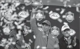  ?? AP/CHUCK BURTON ?? Clemson Coach Dabo Swinney (above) is a stickler for hard work. But in his 10 years at the school, he’s also been keen on celebratin­g success.