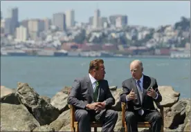  ?? AP PHOTO BY ERIC RISBERG ?? California Gov. Jerry Brown, right, and former Gov. Arnold Schwarzene­gger, left, talk before a climate bill signing on Treasure Island, Tuesday, in San Francisco. Gov. Jerry Brown signed legislatio­n Tuesday keeping alive California’s signature...