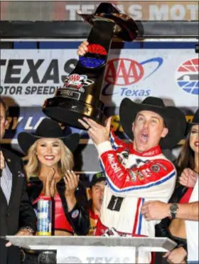 ?? LARRY PAPKE — THE ASSOCIATED PRESS ?? Kevin Harvick celebrates in Victory Lane after winning at Texas Motor Speedway on Sunday.