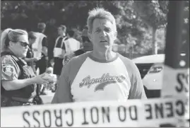  ?? KEVIN S. VINEYS / AP ?? Sen. Jeff Flake, R-ariz., walks toward media gathered Wednesday at the scene of a shooting at a baseball field in Alexandria, Va., during a congressio­nal baseball practice where House Majority Whip Steve Scalise, R-LA., was among four victims who were...