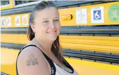 ?? TROY FLEECE ?? Regina Catholic Schools transporta­tion officer Elena Chase displays her school bus tattoo, a mark of pride for her job.