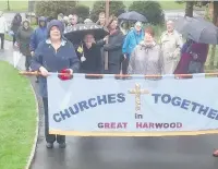  ??  ?? Residents from Great Harwood taking part in the annual ‘Walk with the Cross’