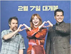  ?? — AFP photo ?? (From left) US actors Sam Rockwell and Bryce Dallas Howard pose with British actor Henry Cavill for photos during a press conference to promote their film ‘Argylle’ in Seoul.