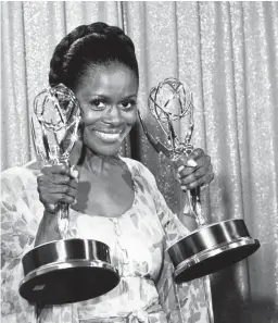  ?? AP FILE ?? Cicely Tyson poses with the Emmys she won in 1974 for her role in “The Autobiogra­phy of Miss Jane Pittman”