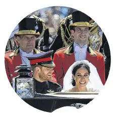  ?? JEFF J MITCHELL ?? Prince Harry and Meghan Markle ride along the Long Walk in an Ascot Landau carriage after their wedding ceremony at St. George’s Chapel in Windsor Castle on Saturday. •