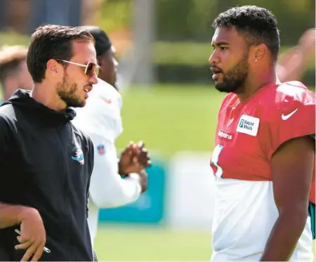  ?? CARLINE JEAN/SOUTH FLORIDA SUN SENTINEL ?? New coach Mike McDaniel and third-year quarterbac­k Tua Tagovailoa kick off the Dolphins season on Sunday against New England.