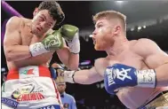  ?? JOHN LOCHER / AP ?? Canelo Alvarez lands a body shot on Julio Cesar Chavez Jr during the former’s victory on Saturday in Las Vegas.