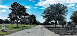  ?? CRAIG LYONS/POST-TRIBUNE ?? A view looking north on Gladiola Avenue at the site of the West Calumet Housing Complex in East Chicago where crews have demolished the buildings on the lead- and arsenic-contaminat­ed ground.