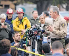  ?? AP PHOTO ?? Ventura County Sheriff Geoff Dean speaks to reporters near the scene in Thousand Oaks, Calif., on Thursday, where a gunman opened fire the previous night inside a country dance bar crowded with hundreds of people. Officials say the suspect is dead inside the bar.