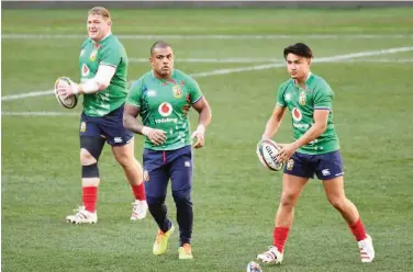  ?? Agence France-presse ?? ↑
British and Irish Lions players take part in a training session ahead of the rugby union first Test match against South Africa in Cape Town on Friday.