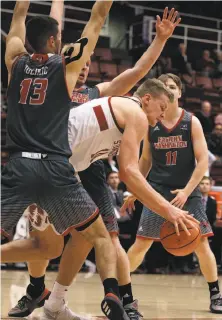  ?? Ben Margot / Associated Press ?? Eastern Washington has Stanford’s Michael Humphrey surrounded as he tries to maneuver with the ball.