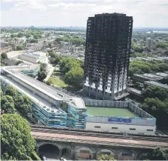  ??  ?? The burnt out shell of the Grenfell apartment tower block is seen in North Kensington. — Reuters photo