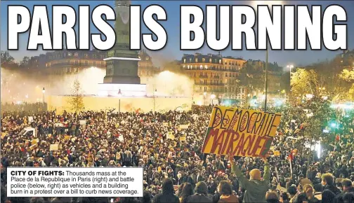  ??  ?? CITY OF FIGHTS: Thousands mass at the Place de la Republique in Paris (right) and battle police (below, right) as vehicles and a building burn in a protest over a bill to curb news coverage.