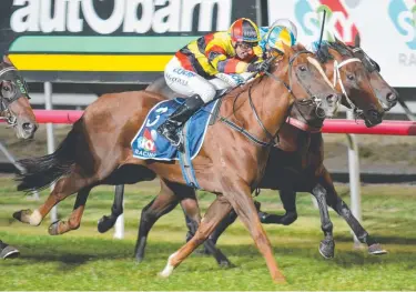  ?? BARRIER ROGUE: Osborne (Brendon McCoull) wins in Launceston last night. Picture: TASRACING ??