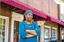  ?? ALYSSA POINTER / ALYSSA.POINTER@AJC.COM ?? Anita Jordan, owner of Benu Glass Creations, stands in front of the building she’s been renting for eight years in the downtown Stone Mountain. Jordan does not have a new retail space lined up but hopes to move her business to another community.