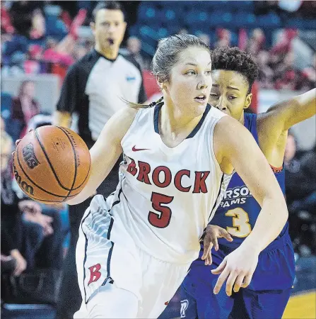  ?? JULIE JOCSAK THE ST. CATHARINES STANDARD ?? Welland native Bridget Atkinson, shown playing against Ryerson in women's university basketball in this file photo, will be enrolled in the security program at Niagara College beginning in September.