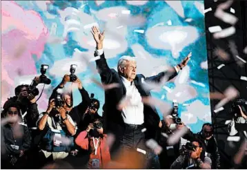  ?? ALEX CRUZ/EPA-EFE ?? Andres Manuel Lopez Obrador celebrates his election victory late Sunday with supporters in Mexico City. The former mayor of Mexico City is a leftist who has long favored a future for Mexico that is less dependent on the United States.
