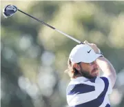  ?? AFP ?? Tommy Fleetwood plays his shot from the 18th tee during the third round at PGA National in Palm Beach Gardens, Florida.