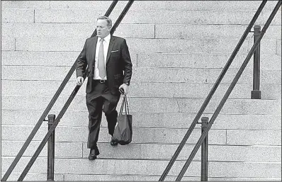  ?? AP/ALEX BRANDON ?? Former White House press secretary Sean Spicer walks down the steps of the Eisenhower Executive Office Building toward the White House on Friday in Washington. Spicer resigned his position Friday, saying the White House “could benefit from a clean...