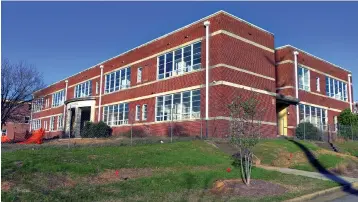  ?? Associated Press ?? ■ The exterior of the Claflin School Apartments complex is shown in Columbus, Ga. The renovation of the former Claflin School is nearing the finish line. Sherry New, regional manager at Gateway Management Company, which will manage the complex, said this week that the apartments are pre-leasing and move-ins will start near the end of February.