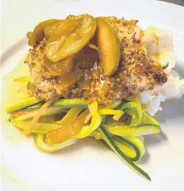  ?? THE MASON JAR CAFE ?? The Mason Jar Café’s walnut crusted mahi-mahi with caramelize­d onions and Granny Smith apples.