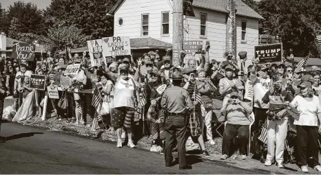  ?? Doug Mills / New York Times ?? Supporters greet President Donald Trump as his motorcade arrives in Old Forge, Pa. Many Trump supporters say he has succeeded on issues that matter to them, and they dismiss as unimportan­t the behavior that critics say makes him unfit for office.