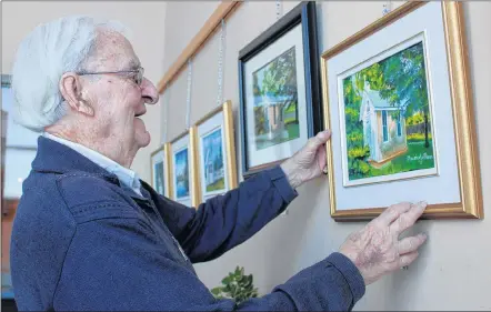  ?? ERIC BOURQUE ?? Father Maurice LeBlanc has paintings on display at the Par-en-Bas school community centre in Tusket. The January/February exhibition features 28 pieces by the well-known Yarmouth County artist.