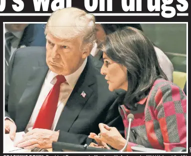  ??  ?? CRACKING DOWN: President Trump speaks Monday with Ambassador Nikki Haley at the UN.