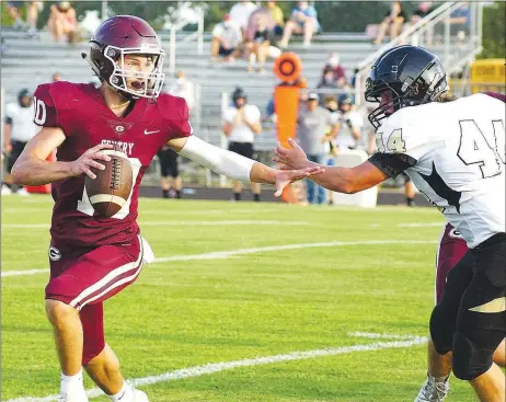  ?? Westside Eagle Observer/RANDY MOLL ?? Gentry quarterbac­k Zach Jarnagan gets past a West Fork defender and looks for an open receiver in the end zone during scrimmage play at Pioneer Stadium on Friday.