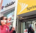  ?? MARK LENNIHAN/AP ?? T-Mobile and Sprint are trying again to combine, in a deal that would reshape the U.S. wireless landscape, the companies announced Sunday.