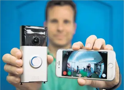  ?? Michael Owen Baker For The Times ?? JAMIE SIMINOFF, founder of Ring, with the doorbell that streams video to a smartphone so users can see who is at the door no matter where they are. The Santa Monica firm has 1 million customers and estimated sales last year of $160 million.