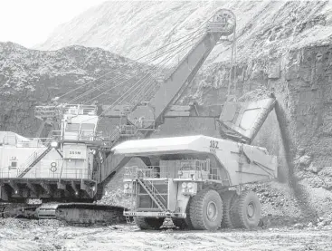  ?? Matthew Brown / Associated Press file ?? A shovel prepares to dump a load of coal into a 320-ton truck in Wright, Wyo. An Energy Department plan would reward nuclear and coal-fired power plants for adding reliabilit­y to the nation’s power grid.