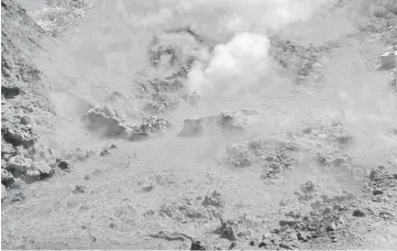  ??  ?? File photo shows Pisciarell­i fumaroles and mud pools from the Campi Flegrei caldera, a super volcano, near Naples. — AFP photo