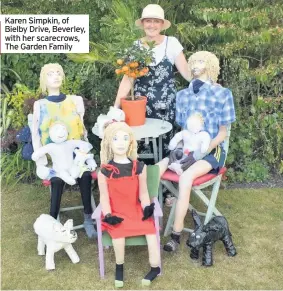  ??  ?? Karen Simpkin, of Bielby Drive, Beverley, with her scarecrows, The Garden Family