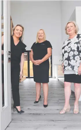  ??  ?? Renee Reynolds, Tanya Di Loreto and Maureen Reynolds in one of the new eight-bedroom rooming houses. Picture: PETER RISTEVSKI