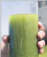  ?? AP PHOTO ?? In this Aug. 3, 2014 file photo, a sample glass of Lake Erie water is photograph­ed near the City of Toledo water intake crib on Lake Erie, off the shore of Curtice, Ohio.