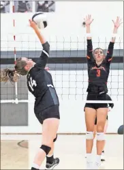  ??  ?? Ridgeland’s Sarah Williams gets set for a spike, while LaFayette’s Sarah Ray looks to defend the play.