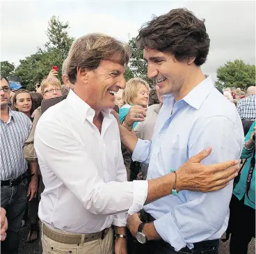  ?? ANDREW VAUGHAN / THE CANADIAN PRESS FILES ?? Liberal leader Justin Trudeau, right, chats with Stephen Bronfman, the party’s chief fundraiser, at a barn party in St. Peters Bay, P.E.I., in 2013.