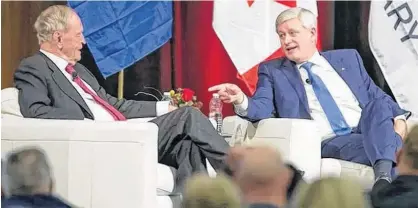  ?? POSTMEDIA ?? Canada’s 20th prime minister Jean Chrétien (left) and 22nd prime minister Stephen Harper speak Thursday in Calgary.